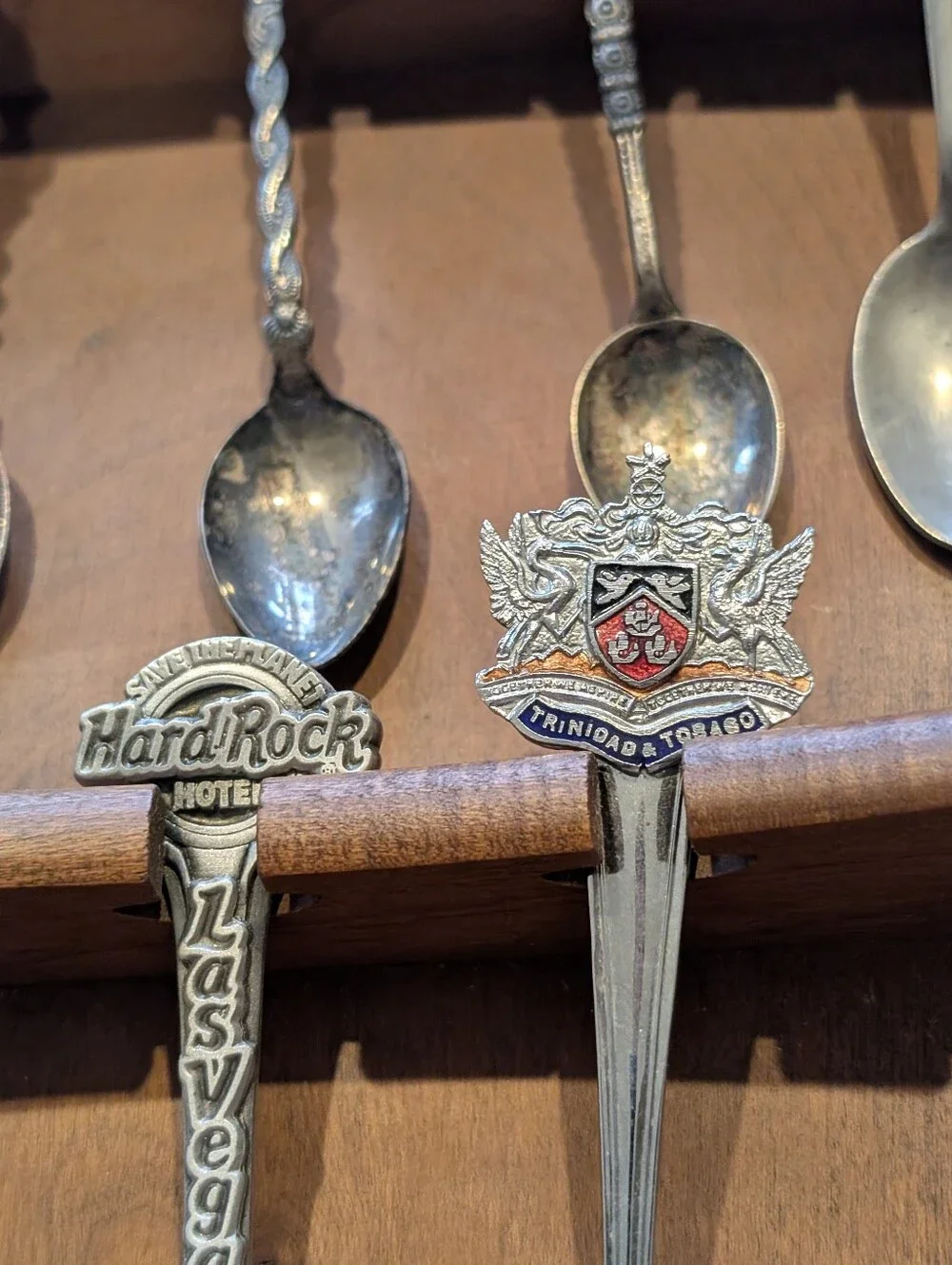 Vintage Decorative Souvenir Spoon Set on Wooden Display